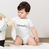 Unbound Co. Baby short sleeve one piece (Wordlogo)